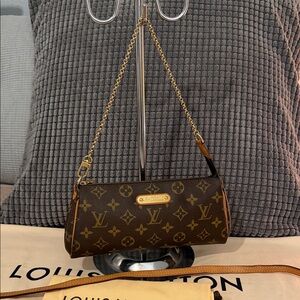 Authentic Eva monogram sling bag